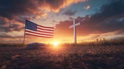 An American flag folded on the ground near a large white cross, with a dramatic, fiery sunset sky overhead, symbolizing unity and sacrifice."