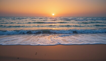 Obraz premium A serene sunset over gentle waves lapping at a sandy beach, evoking tranquility and beauty.