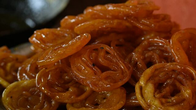 Jalebi sweets. It is a popular sweet snack in India subcontinent. It is many names&nbsp;jilapi,&nbsp;jilebi,&nbsp;jilipi,&nbsp;zulbia,&nbsp;mushabak,&nbsp;z&rsquo;labia and&nbsp;zalabia. Its made by maida flour&nbsp;batter&nbsp;and sugar syrup.
