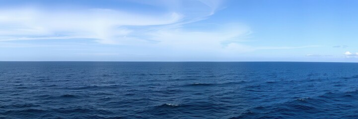Obraz premium A breathtaking wide-angle shot of the vast ocean showing clear blue water, gentle waves, and a distant horizon line, marine, scenic, wide-angle