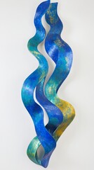 A colorful, abstract sculpture featuring flowing, wavy forms in blue and gold hues.