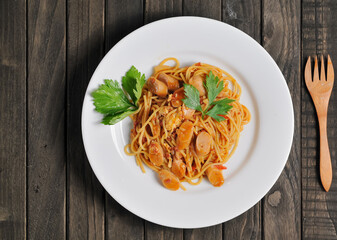 Fried spaghetti served on a white plate