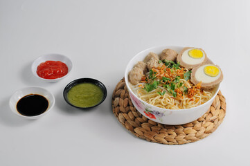 Mie bakso is an Indonesian noodle soup dish consists of bakso meatballs served with yellow noodles and rice vermicelli