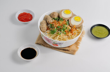 Mie bakso is an Indonesian noodle soup dish consists of bakso meatballs served with yellow noodles and rice vermicelli