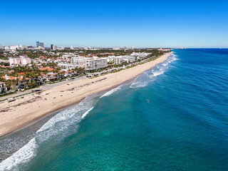 Oceanfront hotels, apartments, and condos with downtown Palm Beach in the background in Palm Beach County, Florid