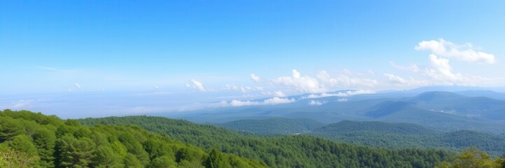 Naklejka premium Majestic mountain landscape with clouds rolling in over lush green forests and a clear blue sky above, green, nature, clear