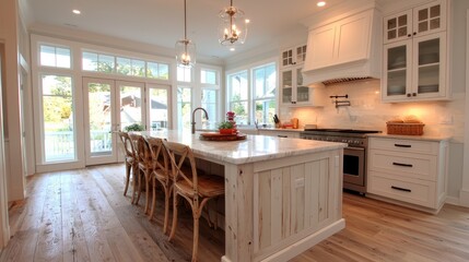 Bright kitchen with island, hardwood floors, and French doors.
