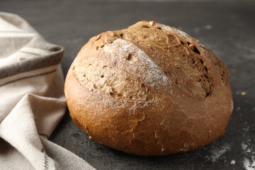 Freshly baked bread on grey table, closeup