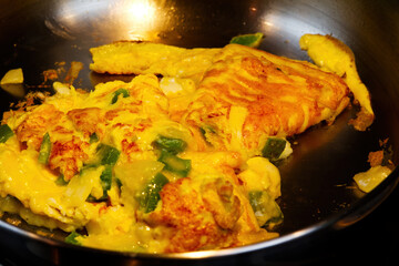 Messy Vegetable And Cheese Omlet In Pan