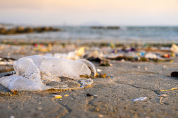 Top view trash, plastic cups and plastic bags at the beach. environmental problem concept and healing the world	