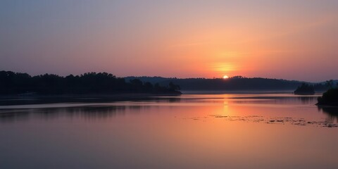 Fototapeta premium A serene sunset over a tranquil lake with vibrant colors reflecting in the water, landscape, peacefulness, calmness