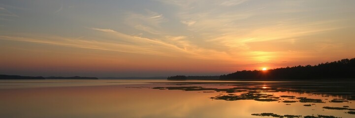 A stunning sunset over a calm lake with vibrant colors reflecting in the water, scenes, beauty, peaceful