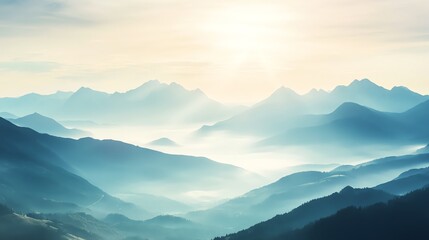 Obraz premium Majestic mountain range under soft morning light, enveloped by serene mist and tranquil sky.