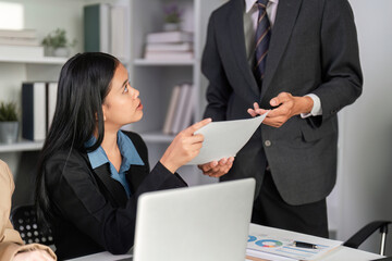 Business Team Collaborating on Data Analysis with Graphs and Charts in a Modern Office Setting