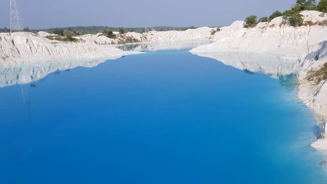 Enchanting video of Blue and Green Kaolin Lake in Bangka, Bangka Belitung, Indonesia. This lake is a former mining excavation area, now used for tourist