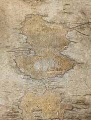 texture of old wall with cracks and torn burlap