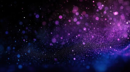 Obraz premium Abstract background with purple and blue glitter bokeh effect.