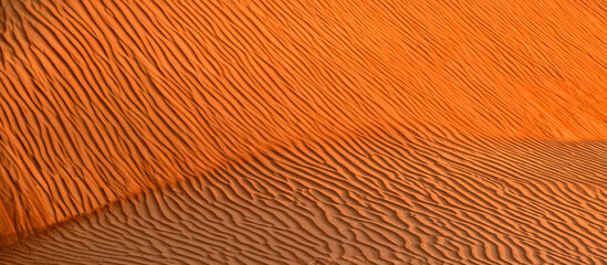 Fototapeta premium Desert background pattern graphics. Summer Safari excursions and travel. Sandy desert Wahiba in Oman, Near East 