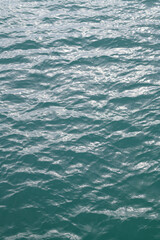 Water view. Sea water background. Green blue ocean water texture background. Sea water and ripples. Ocean background.