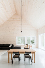 Fototapeta premium Modern cabin interior with wooden walls and minimalist furniture in a serene setting