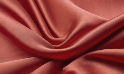 A close-up of smooth red fabric with soft folds, creating a textured background. Ideal for themes like Chinese New Year or elegant designs. The vibrant hue symbolizes prosperity and celebration.