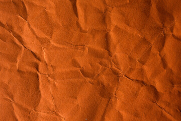 Orange crinkle paper background.