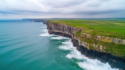Dramatic Coastal Cliffs with Waves Crashing Against Rocky Shore Under a Brooding Sky in a Scenic Landscape