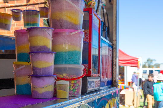 Buckets of colourful fairy floss at a country show