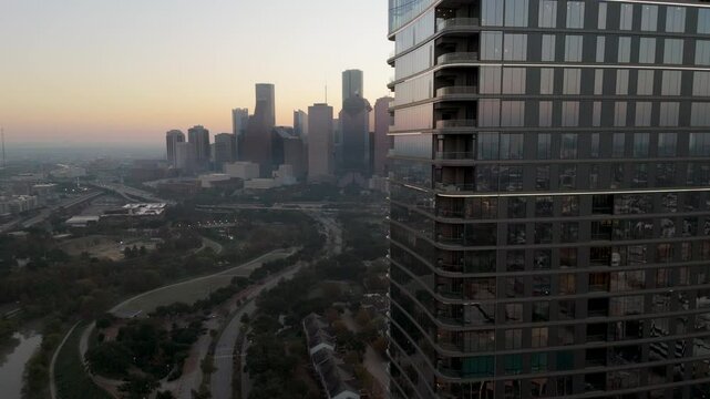 Breathtaking aerial view beautifully captures the stunning skyline of Houston Downtown at sunrise, highlighting the impressive modern skyscrapers alongside the lush landscapes that define Texas, USA
