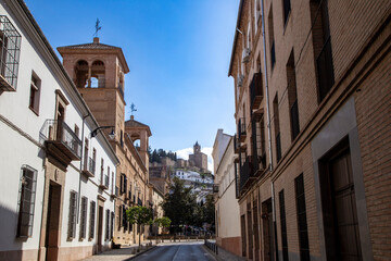 Antequera Street with the Alcazaba in the background. Malaga, Andalusia, Spain.