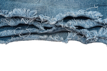 Piece of torn denim on a white background. Denim texture