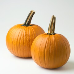 Two whole pumpkins on a white background, front view, slightly angled, bright orange, diffused natural light, studio quality