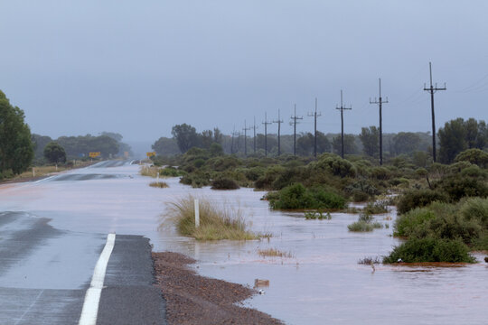 Flooded bitumen road near Kalgoorlie in Western Australia