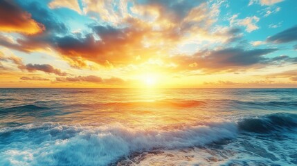 Obraz premium Breathtaking sunrise over a serene ocean displaying a vibrant yellow and blue sky, creating a tranquil atmosphere with ample photo style copy space for your needs.