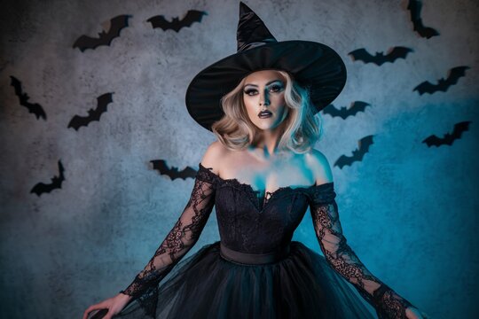 A dramatic portrait of a woman in a glamorous witch costume.