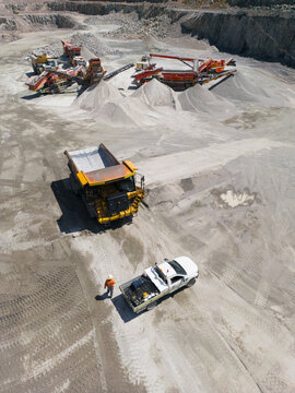 Aerial view of a dump truck in a quarry.