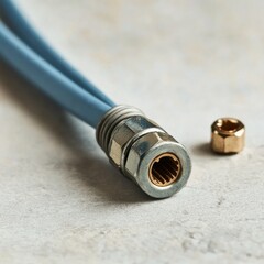 Close-up of a blue hose connector with a metallic fitting and nut, showcasing intricate details and textures.