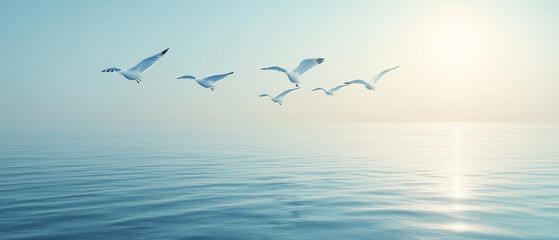 Fototapeta premium Serenity Seagulls in Flight Over Calm Ocean.