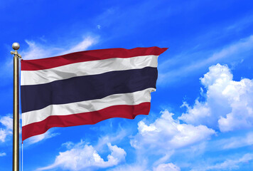 Thailand National Flag Waving Against Clear Blue Skies