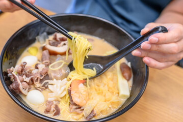 Authentic Korean Malatang Hotpot with Fresh Ingredients and Noodles in a Casual Restaurant Setting