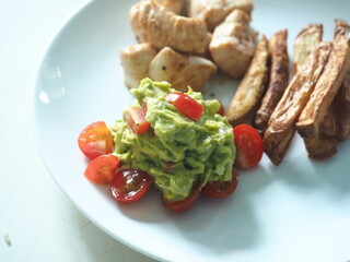 guacamole with fresh cherry tomatoes