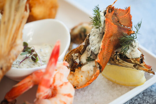 Close up selection of seafood platter featuring a section of lobster