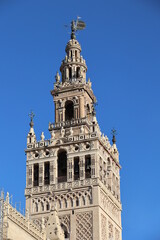 Fototapeta premium The Giralda is the bell tower of the Cathedral of Seville, Andalusia, Spain 