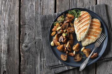 grilled chicken breasts with mushrooms, top view
