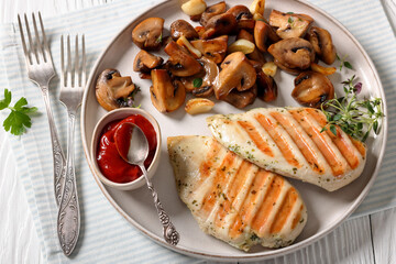 grilled chicken breasts with mushrooms, top view