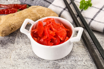 Marinated ginger root in the bowl
