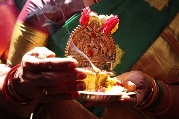 lighting of kuthu vilaku or kamatchi amman vilaku in south Indian tradition