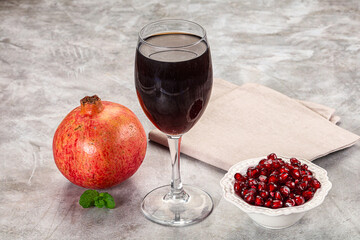 Sweet fresh pomegranate juice with fruit
