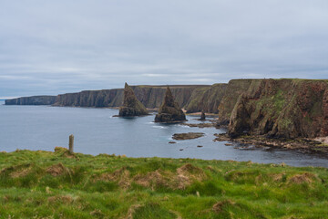 Obraz premium Duncansby Stacks rise from the North Sea near John o' Groats, Scotland