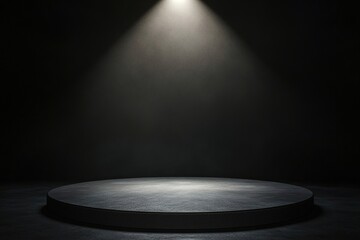 Dimly lit stage with spotlight highlighting circular platform, c